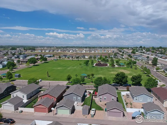 an aerial view of a house with a garden