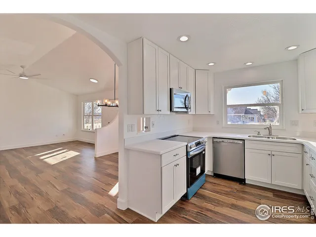 a kitchen with a sink stove and refrigerator