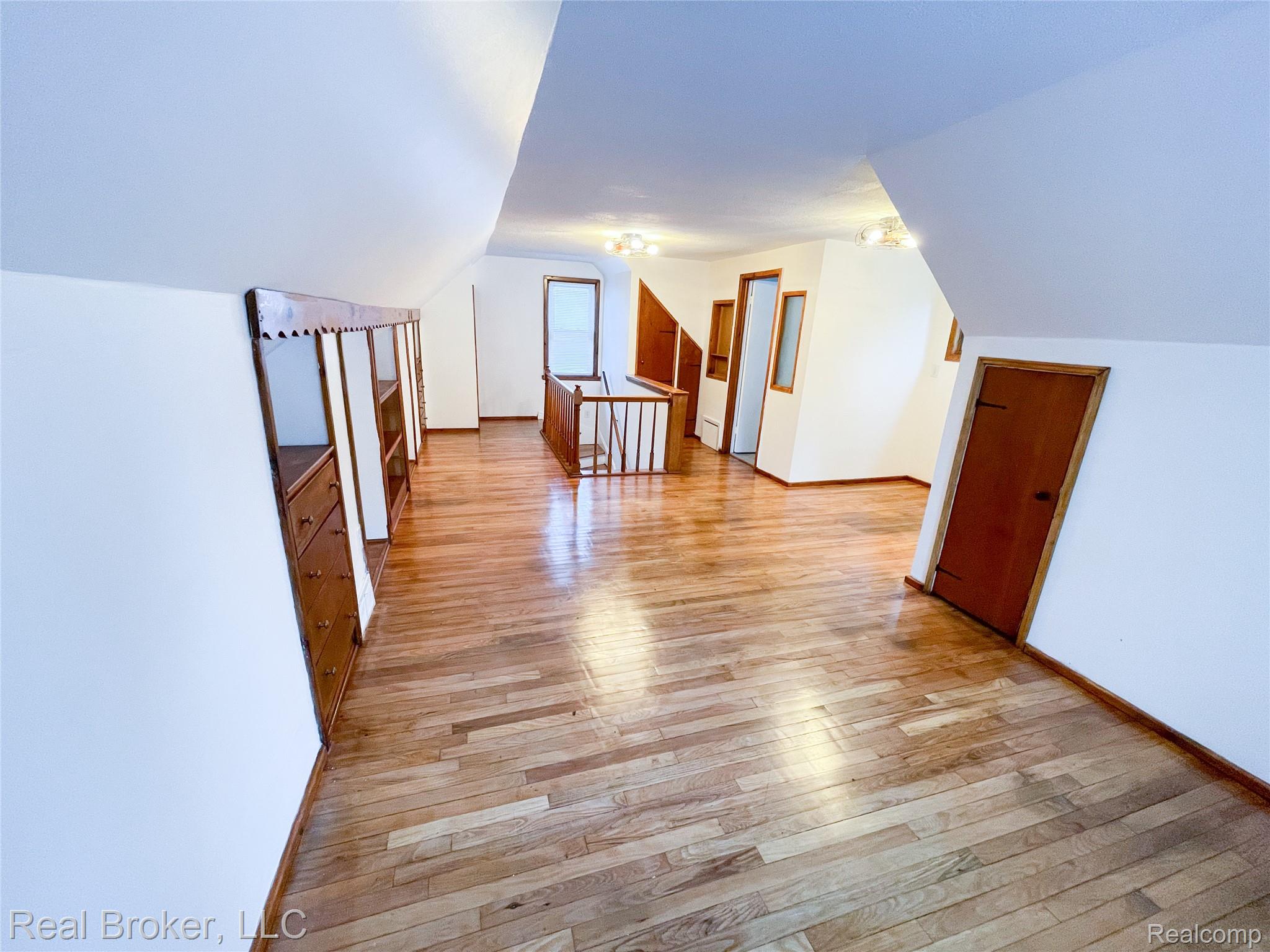 603 Vernier Road Grosse Pointe, MI 48236 - Photo 12 of 33 Additional living space with light wood-style floors and lofted ceiling