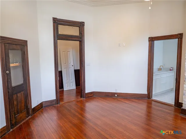 a kitchen with a sink cabinets and stainless steel appliances