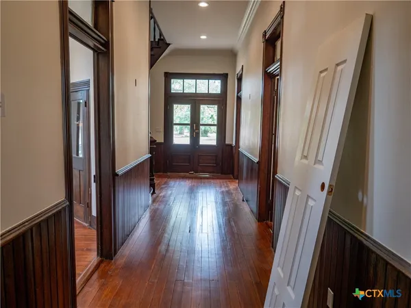a view of a livingroom with wooden floor