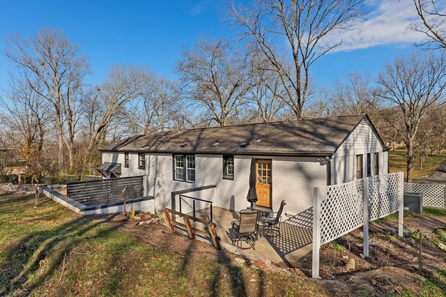 a backyard of a house with seating space