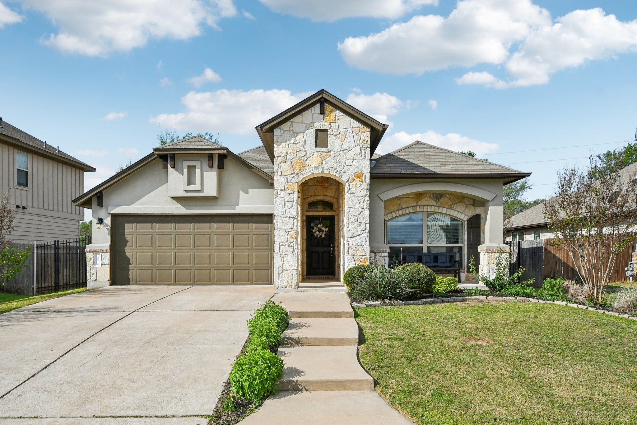 13412 Larrys Lane Manchaca, TX 78652 - Photo 1 of 1 a front view of a house with garden