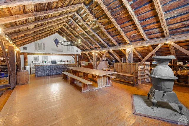 a roof deck with table and chairs