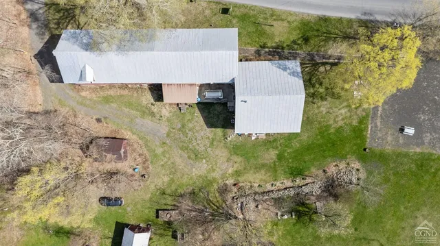 a view of a swimming pool with a house in the background