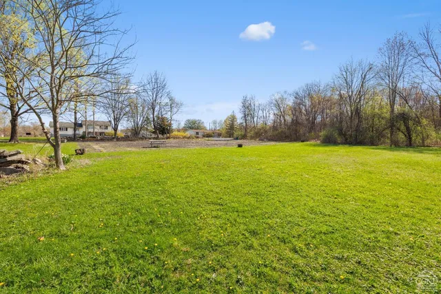 a view of a lake with a house in the background
