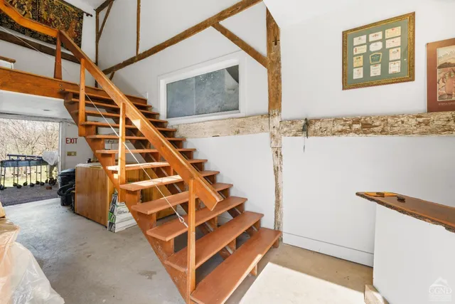 a view of an empty room with stairs