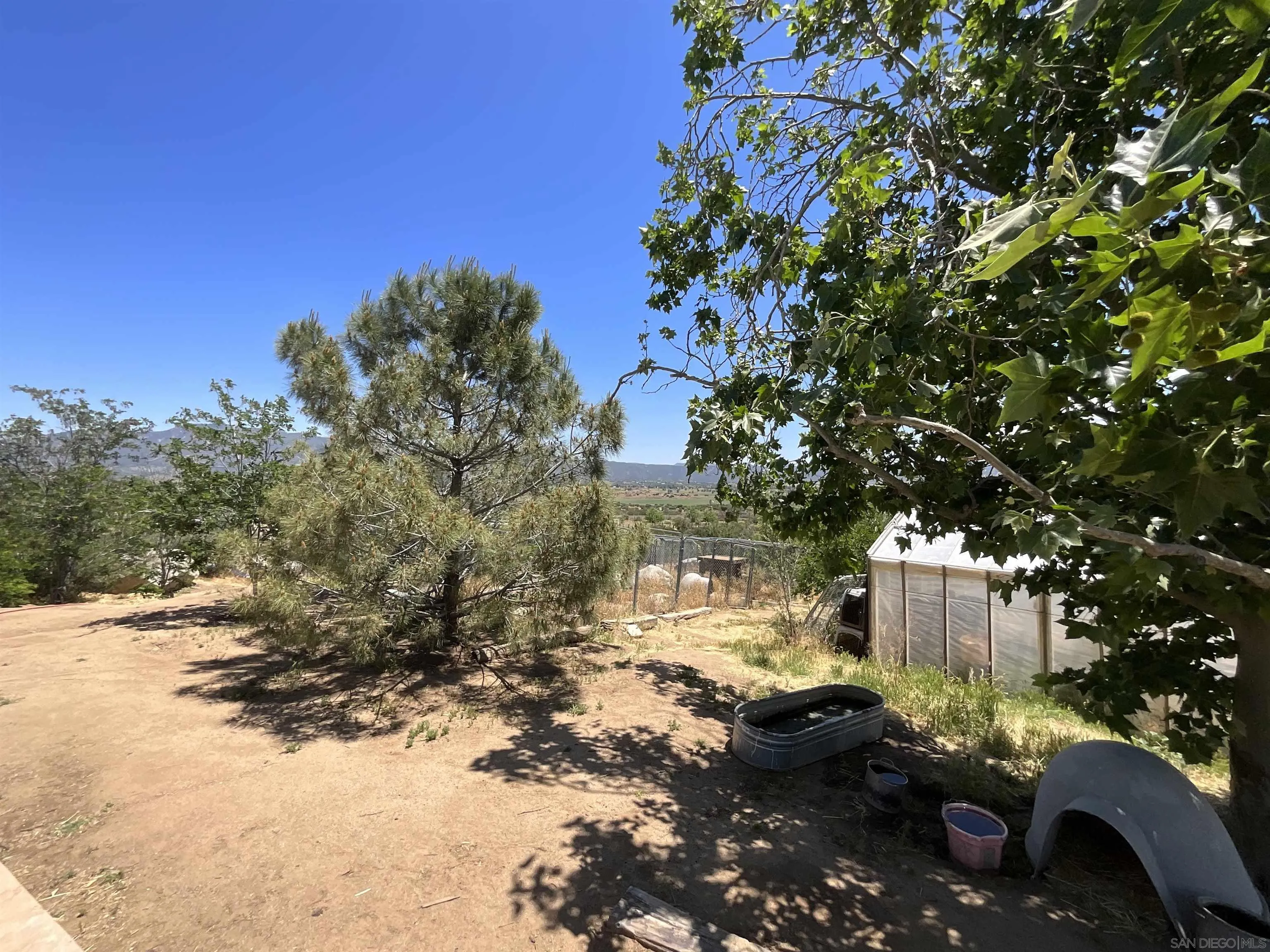 39745 Bautista Road Anza, CA 92539 - Photo 4 of 27 a backyard of a house with lots of green space