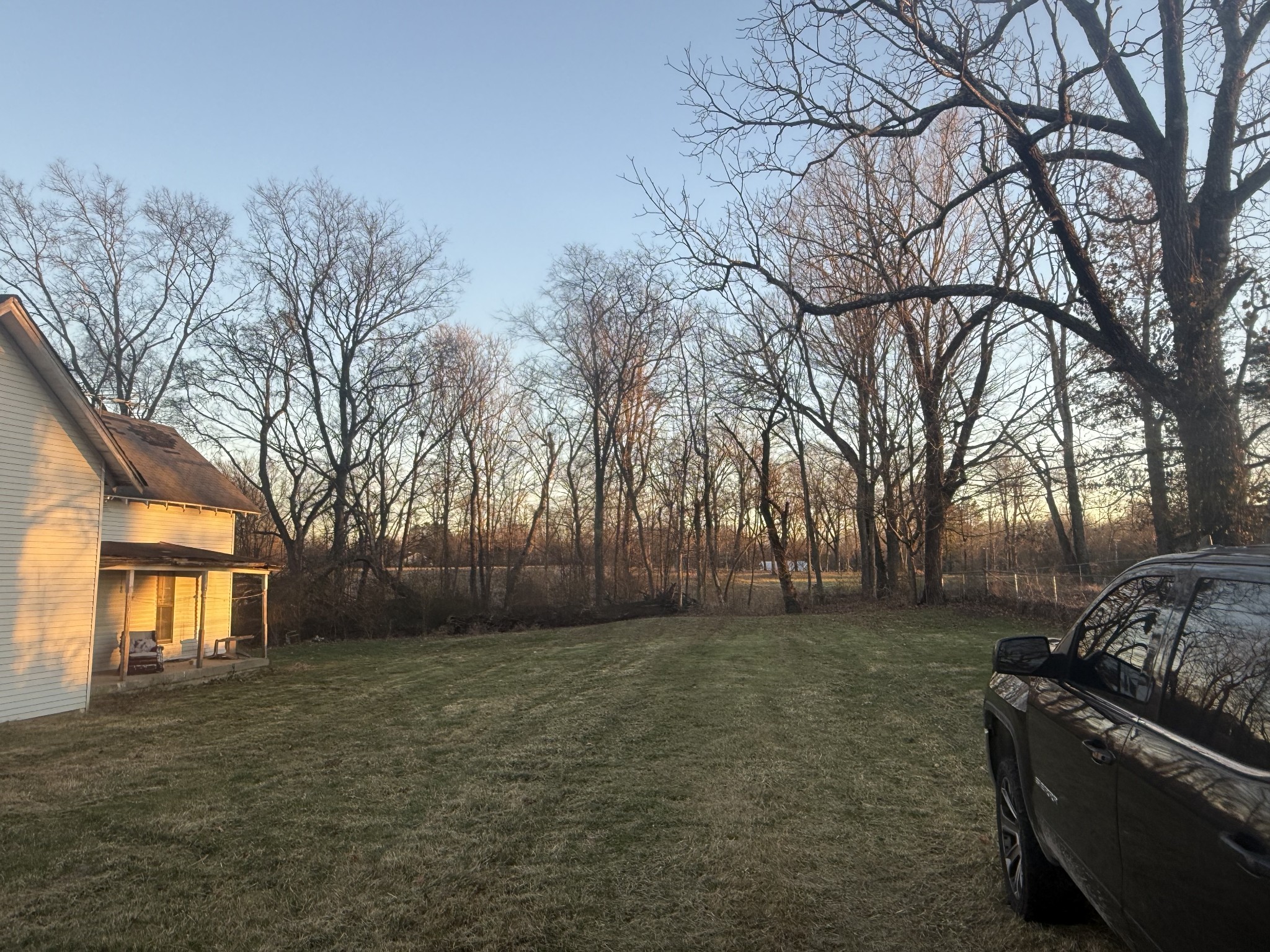2627 Woods Road Springfield, TN 37172 - Photo 4 of 9 a backyard of a house with large trees