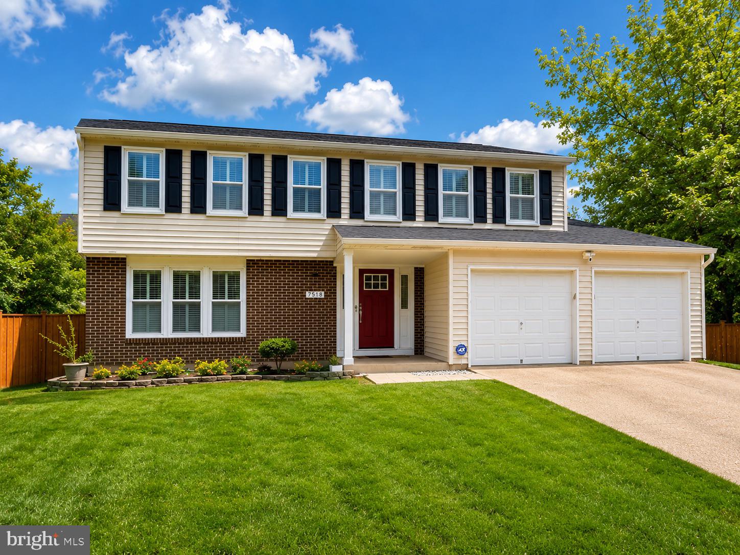 7518 Candytuft Court Springfield, VA 22153 - Photo 2 of 47 a front view of a house with a yard