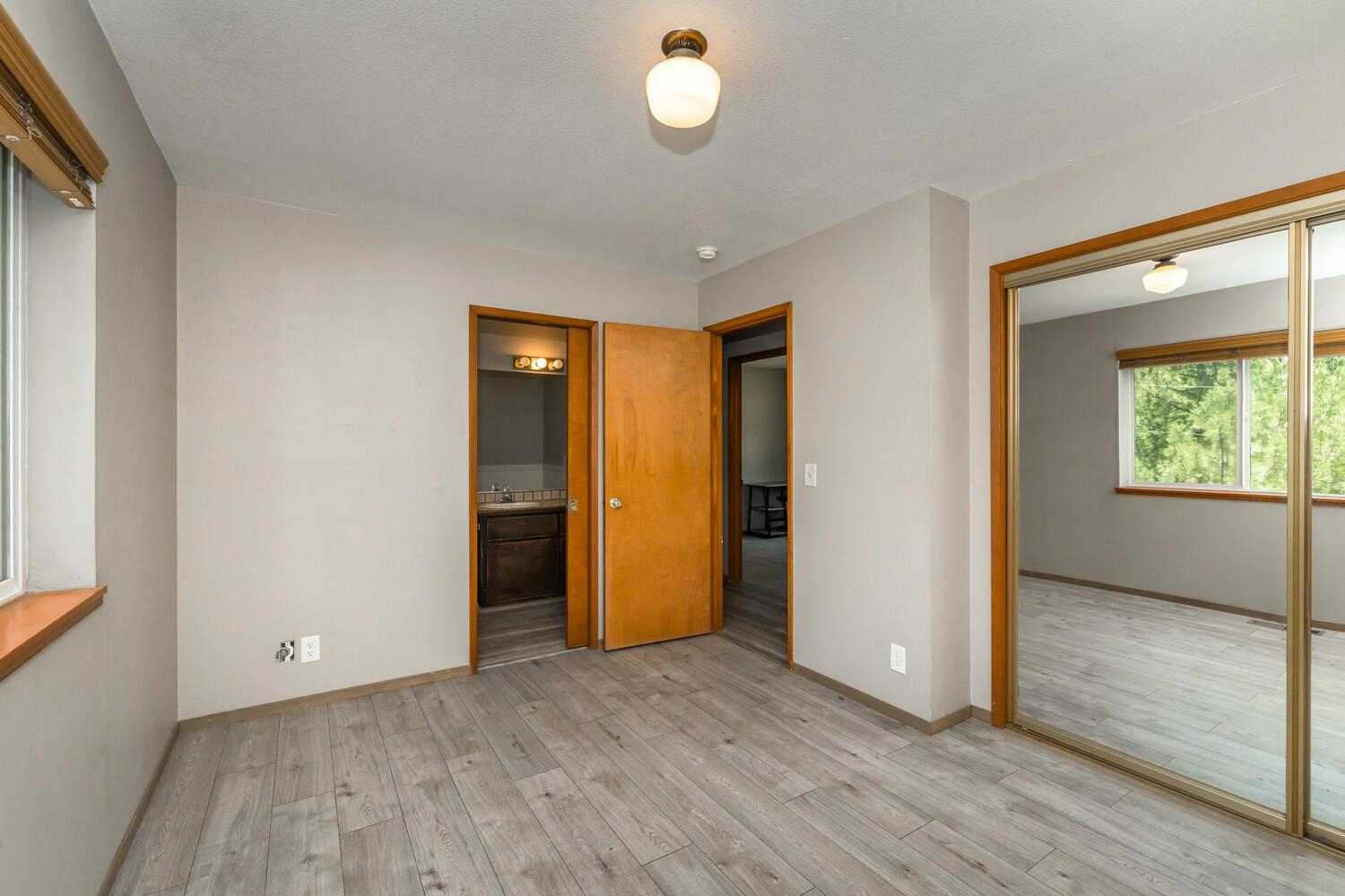 10332 Sugar Pine Road Truckee, CA 96161 - Photo 17 of 25 an empty room with wooden floor and windows