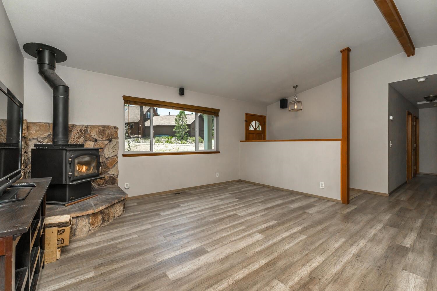 10332 Sugar Pine Road Truckee, CA 96161 - Photo 7 of 25 a view of an empty room with a window and wooden floor