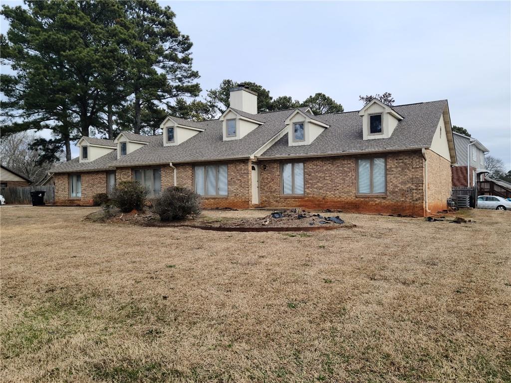2120 Fieldstone View Court Southeast Conyers, GA 30013 - Photo 1 of 1 a front view of a house with a yard