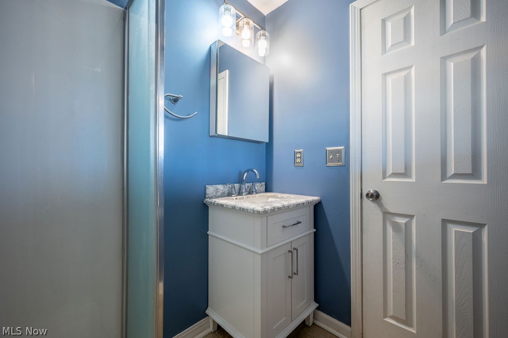 3601 River Road Vienna, WV 26105 - Photo 19 of 40 Bathroom featuring vanity and a shower stall