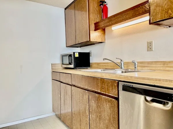 a kitchen with a sink and cabinets