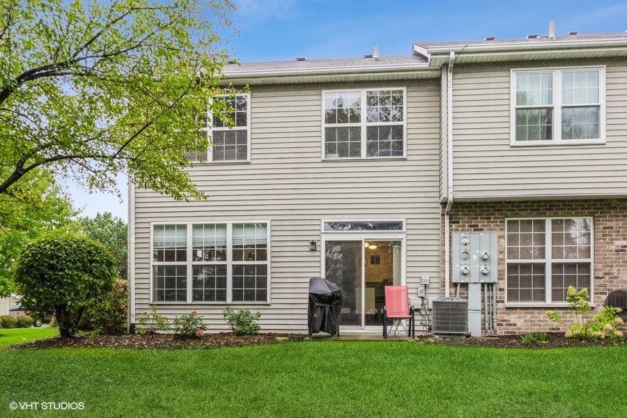 24099 Pear Tree Circle Plainfield, IL 60585 - Photo 16 of 17 a front view of a house with a yard and green space