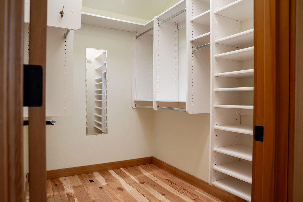61275 Victory Loop Bend, OR 97702 - Photo 21 of 59 Primary walkin closet with storage unit and solar tube for additional light