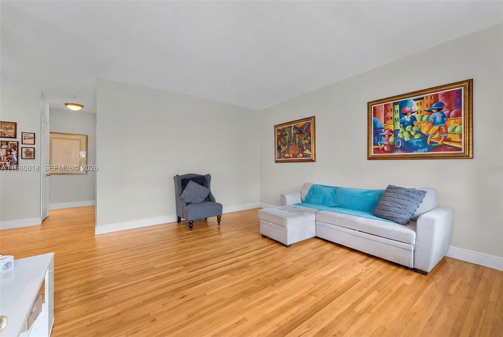 320 85th Street, Unit 15 Miami Beach, FL 33141 - Photo 3 of 13 a living room with furniture and wooden floor
