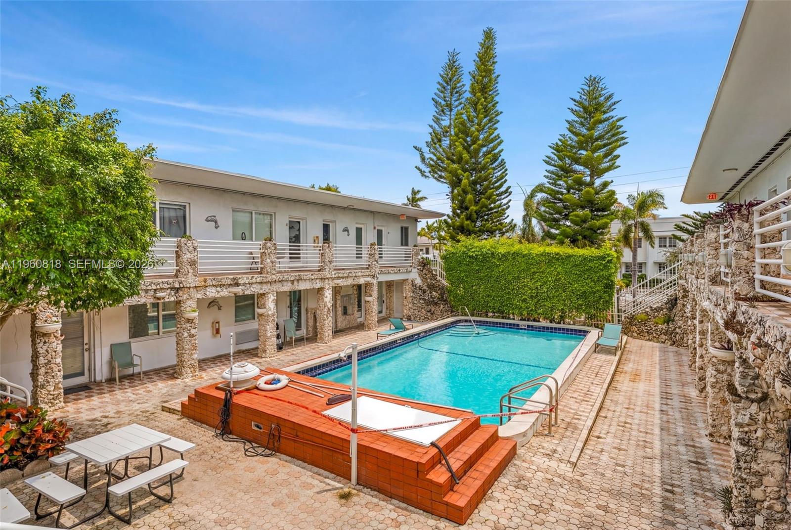 320 85th Street, Unit 15 Miami Beach, FL 33141 - Photo 9 of 13 a view of a house with backyard and sitting area