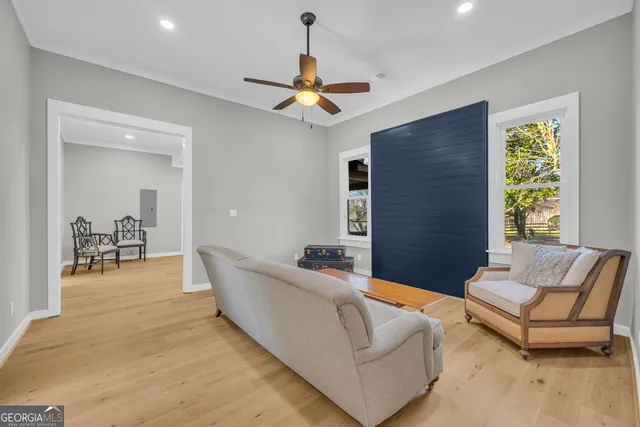 a large kitchen with kitchen island a sink stainless steel appliances and cabinets