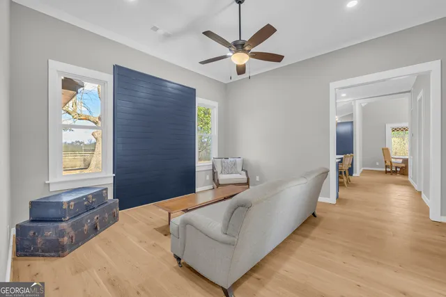 a kitchen with stainless steel appliances a sink a stove a refrigerator cabinets and a counter top space