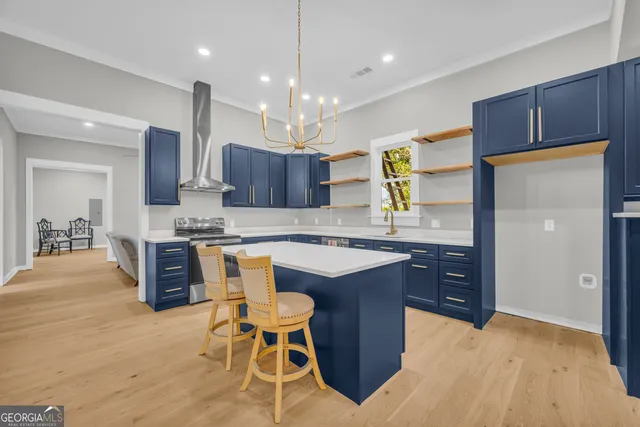 a view of room with furniture and wooden floor