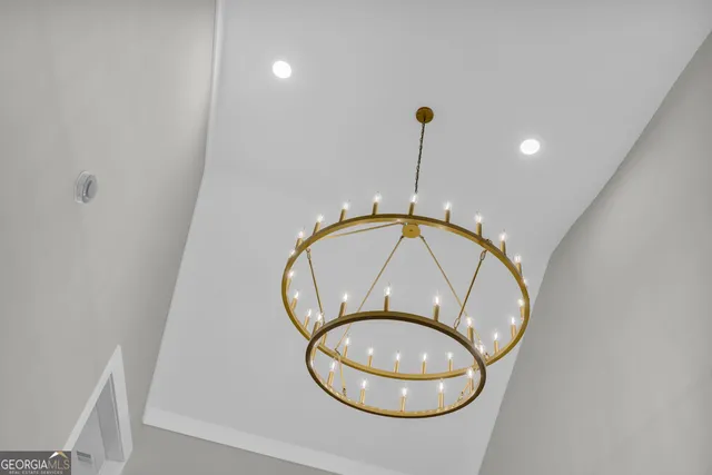 a view of a room with wooden roof and stairs