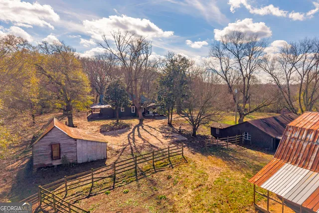 a kitchen with stainless steel appliances granite countertop a kitchen island a stove a table and chairs in it