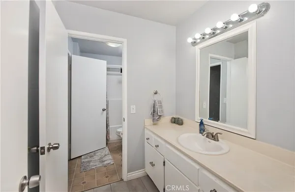 a bathroom with a double vanity sink and mirror