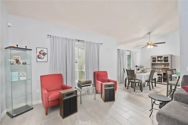 a living room with furniture a rug and a table