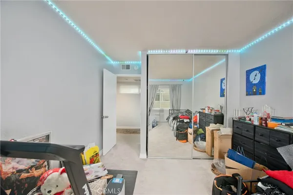 a bedroom with a bed and a couch