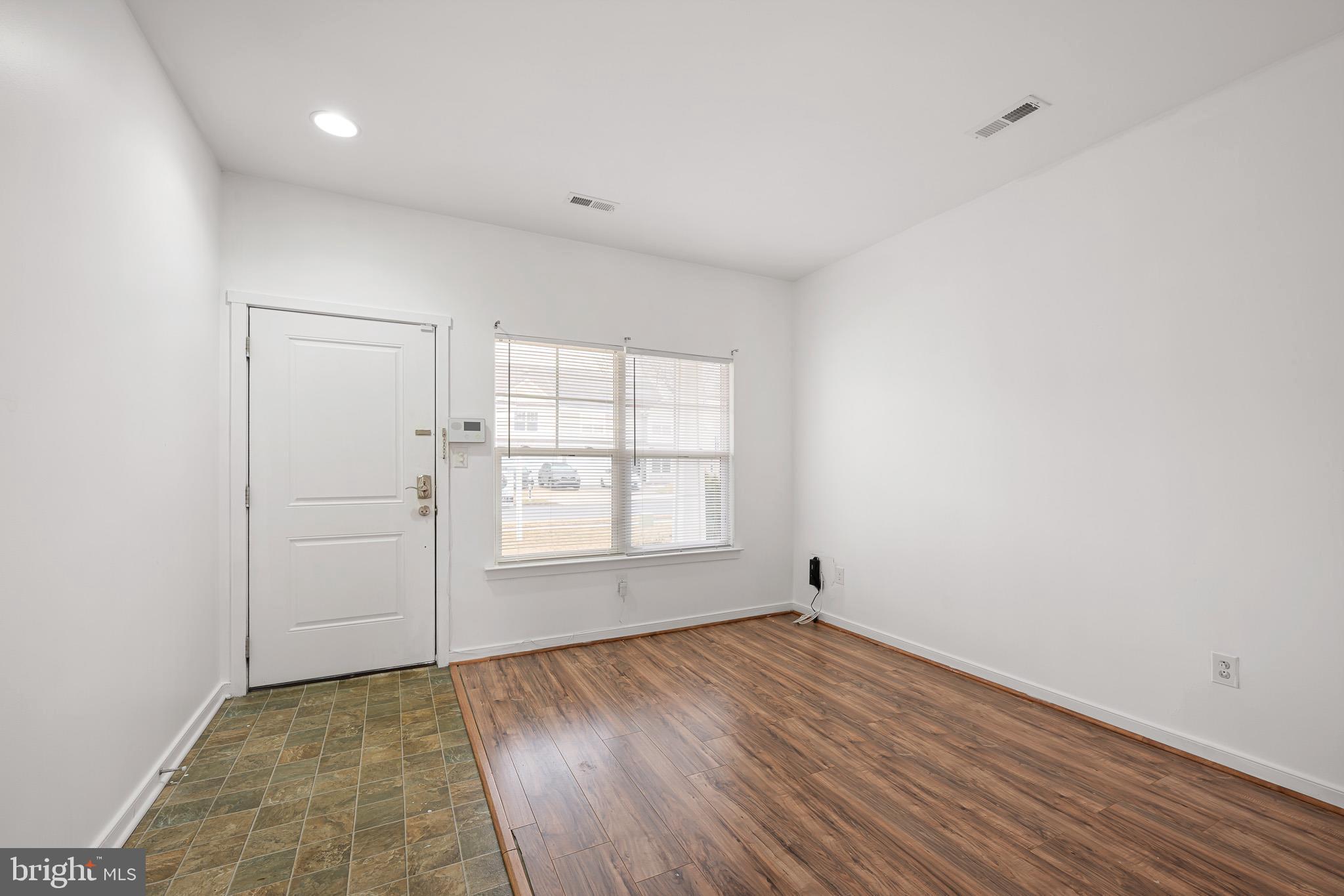 42 Mer Way Dover, DE 19901 - Photo 19 of 36 an empty room with wooden floor and windows