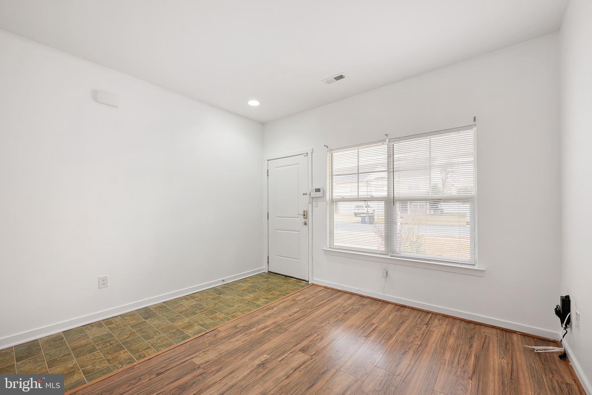 42 Mer Way Dover, DE 19901 - Photo 20 of 36 an empty room with wooden floor and windows