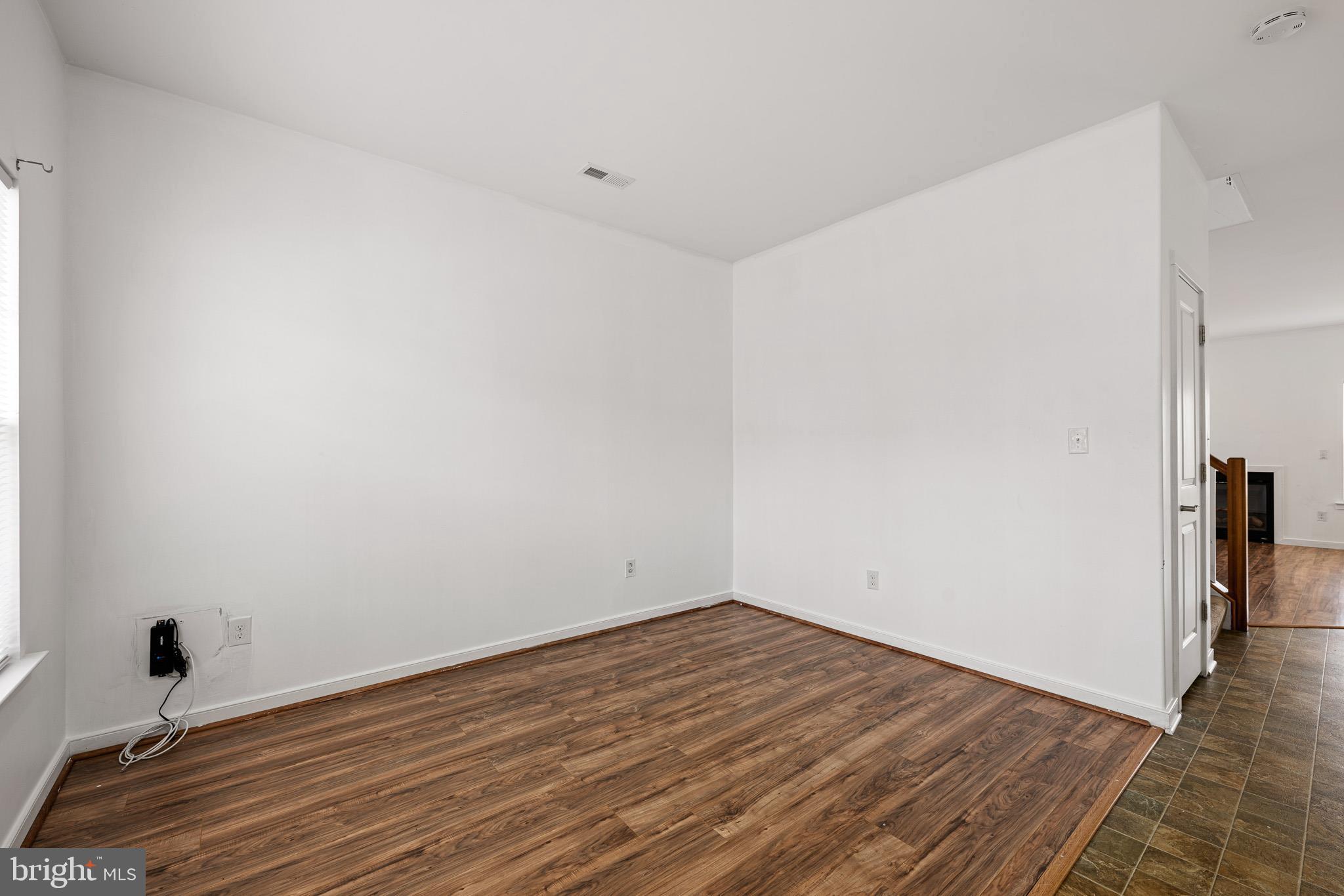 42 Mer Way Dover, DE 19901 - Photo 22 of 36 a view of a room with wooden floor and a ceiling fan