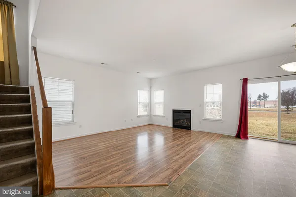 a view of a kitchen with a stove cabinets and wooden floor
