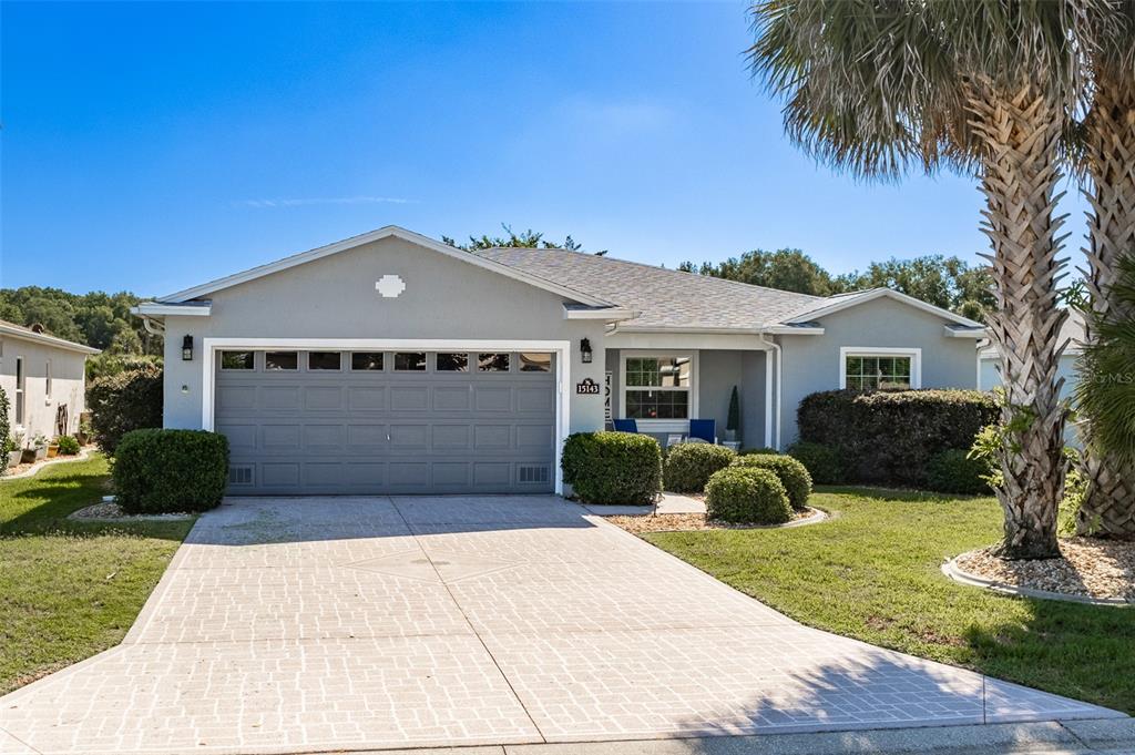 15143 Southwest 14th Avenue Road Ocala, FL 34473 - Photo 2 of 53 a front view of a house with garden