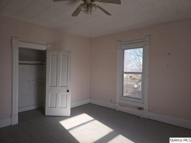 243 Main Street Carthage, IL 62321 - Photo 16 of 26 an empty room with windows