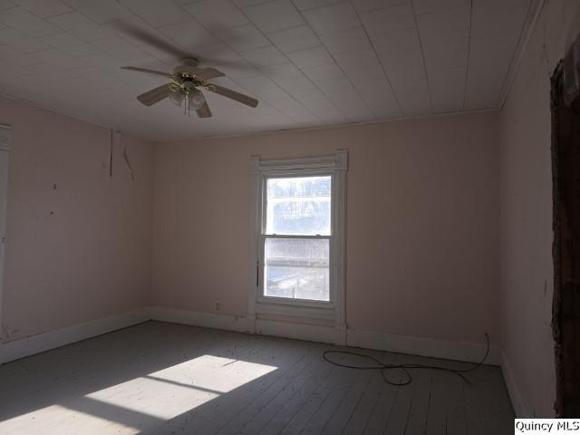 243 Main Street Carthage, IL 62321 - Photo 17 of 26 an empty room with windows and fan