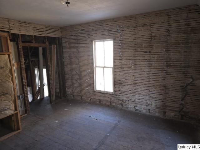 243 Main Street Carthage, IL 62321 - Photo 21 of 26 a view of empty room with window