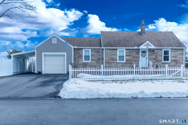 a front view of a house with a garage