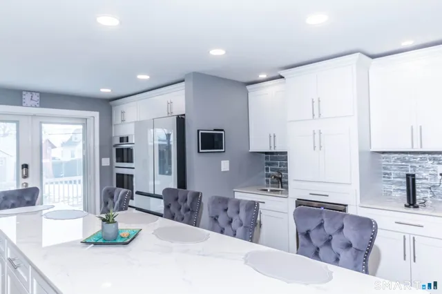 a living room with fireplace furniture and a fireplace