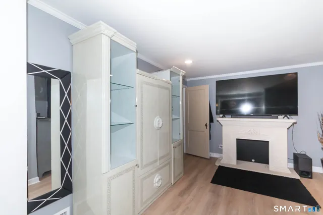 a view of a room with wooden floor and chair