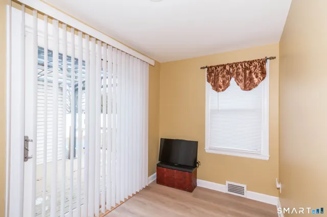 a bathroom with a sink mirror vanity and toilet