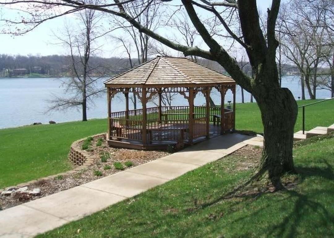 123 Newport Road Davis, IL 61019 - Photo 6 of 11 a view of a backyard with a garden and trees