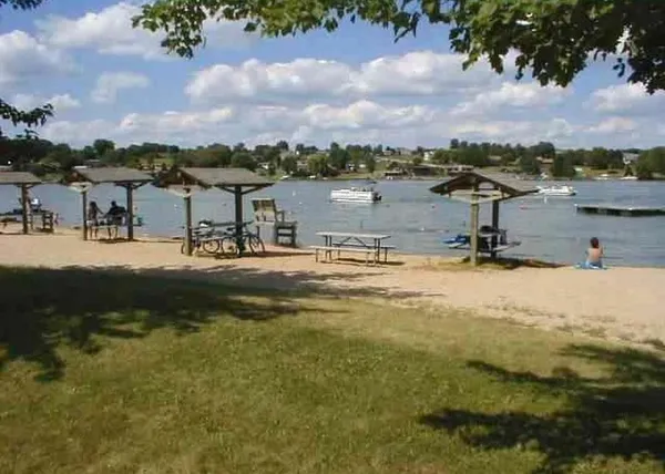 a view of a lake with boats and trees