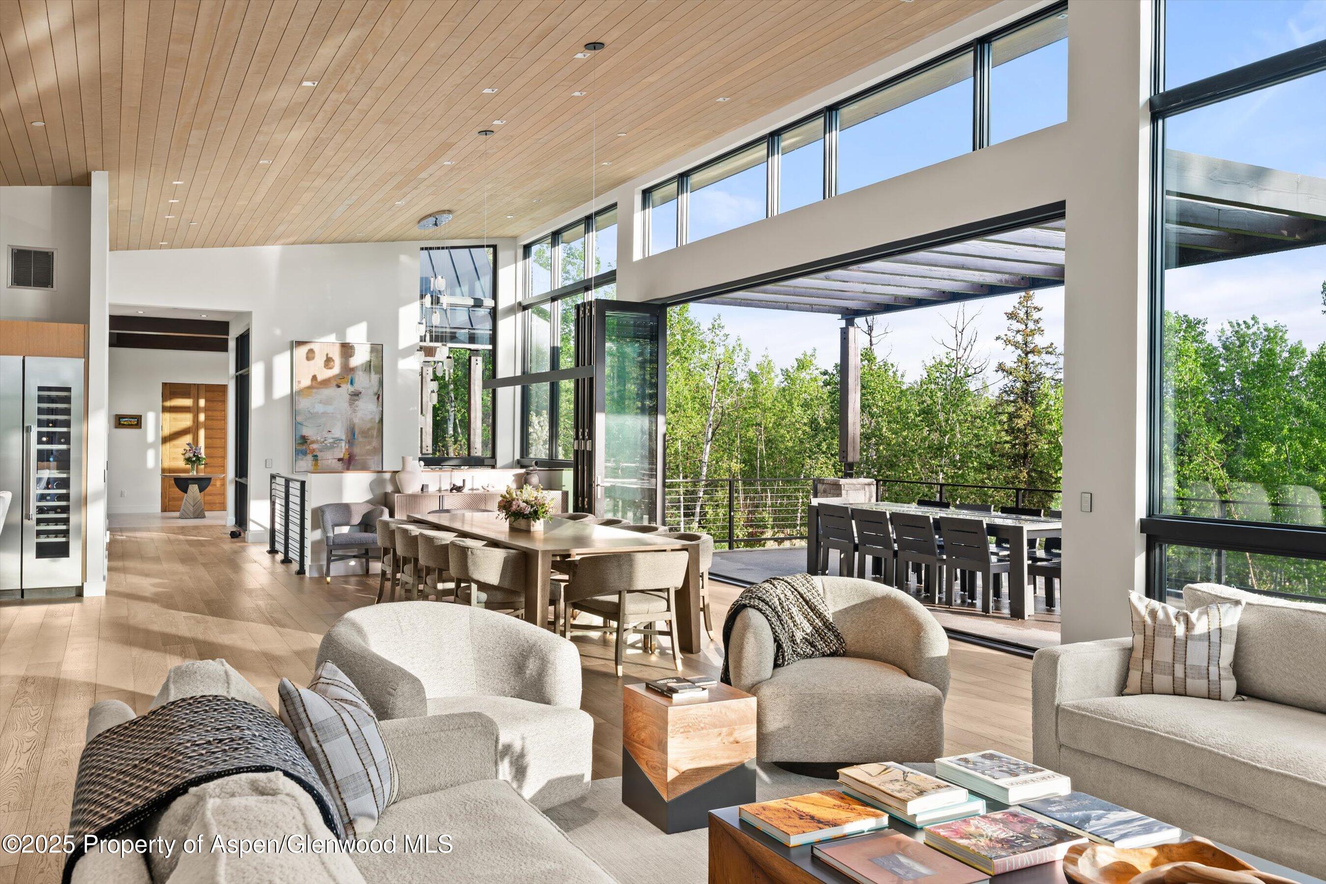 1234 Wood Road Snowmass Village, CO 81615 - Photo 21 of 66 a living room with furniture and large windows