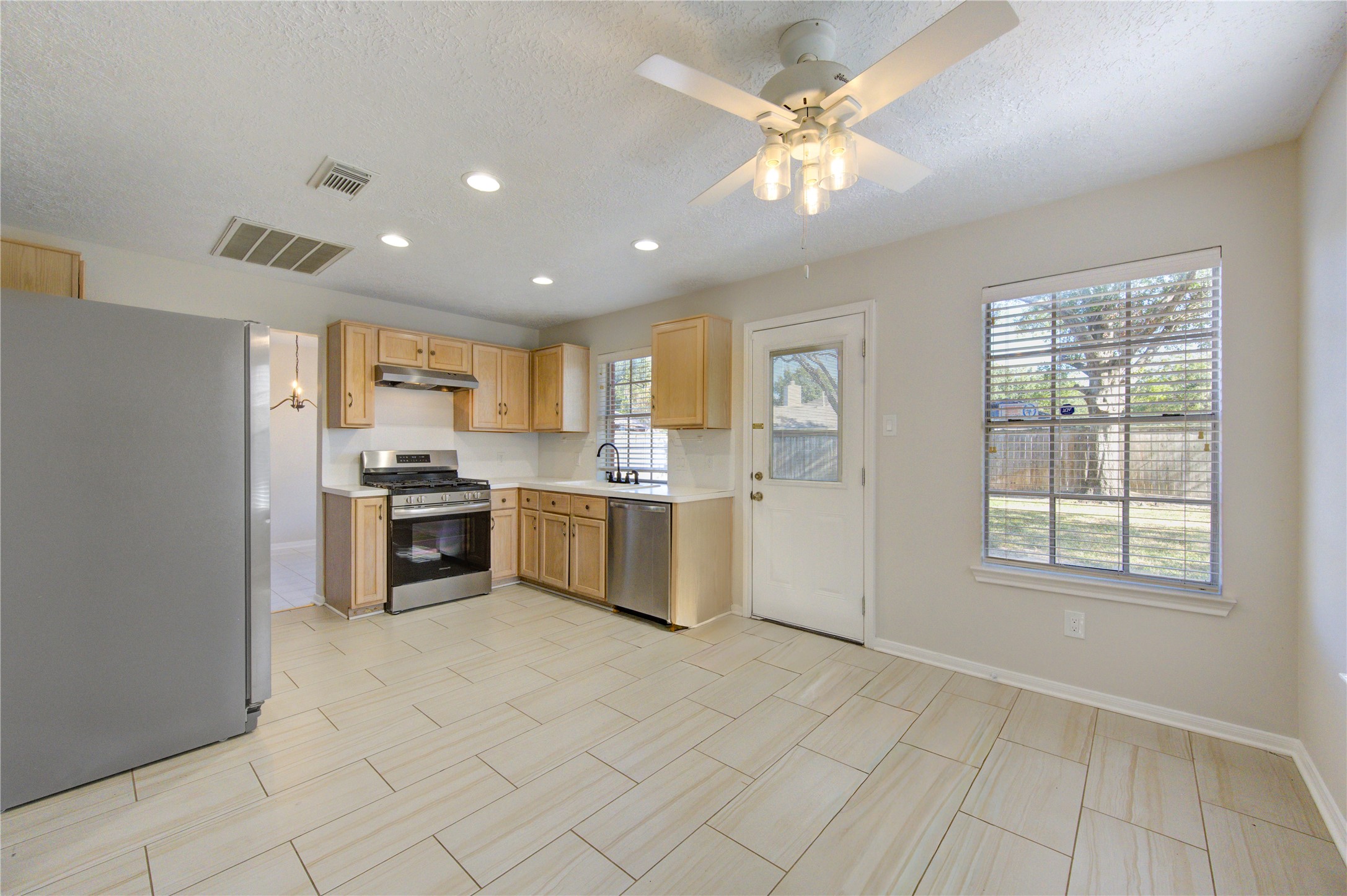 2518 Calvary Lane Katy, TX 77449 - Photo 11 of 26 a kitchen with cabinets and window