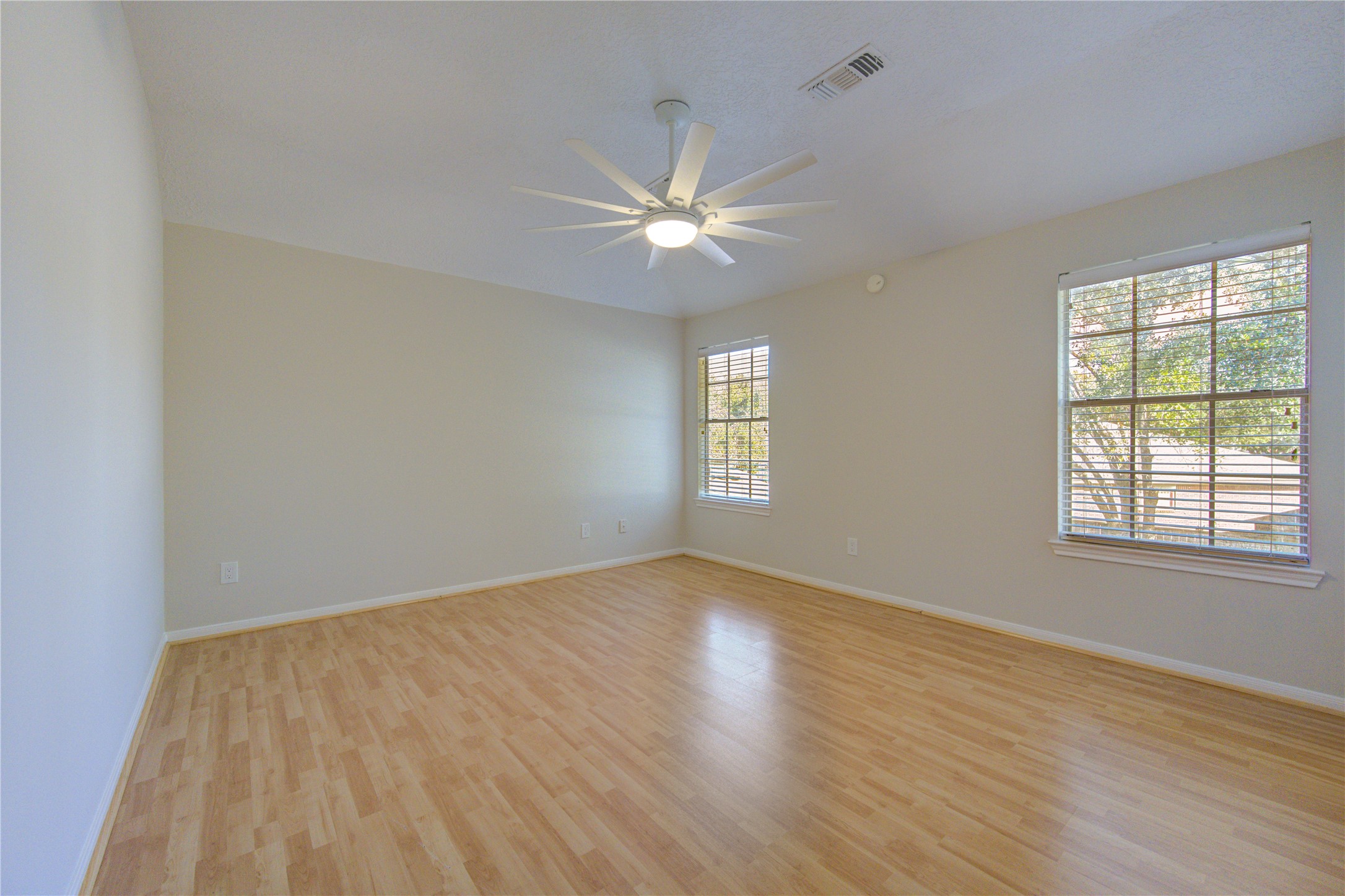 2518 Calvary Lane Katy, TX 77449 - Photo 19 of 26 wooden floor in an empty room with a window