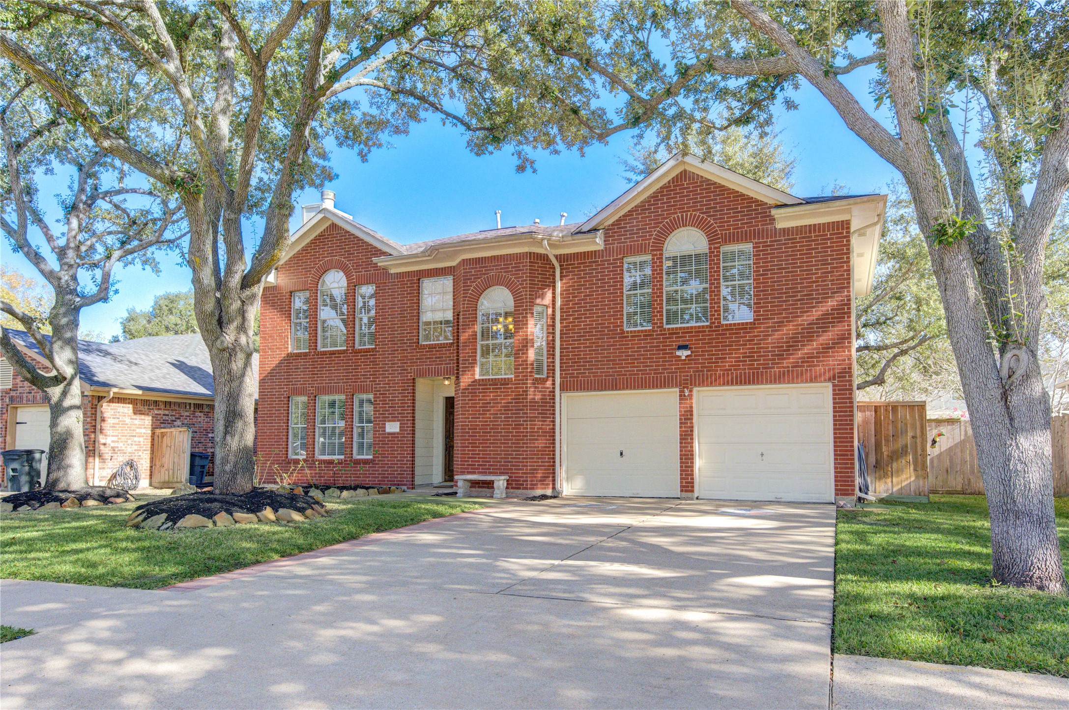 2518 Calvary Lane Katy, TX 77449 - Photo 2 of 26 a front view of a house with a yard and garage