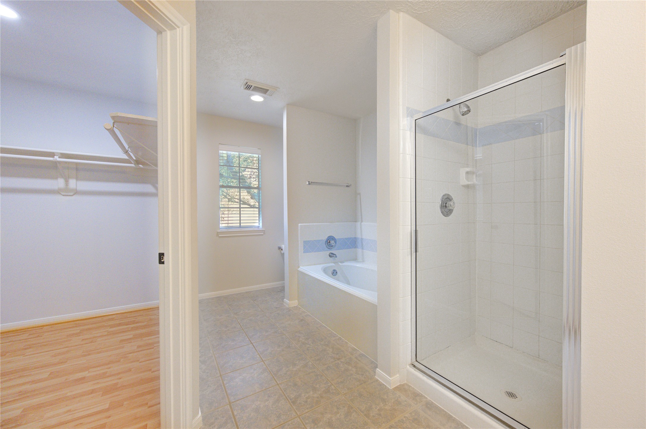 2518 Calvary Lane Katy, TX 77449 - Photo 21 of 26 a bathroom with a shower and a bath tub